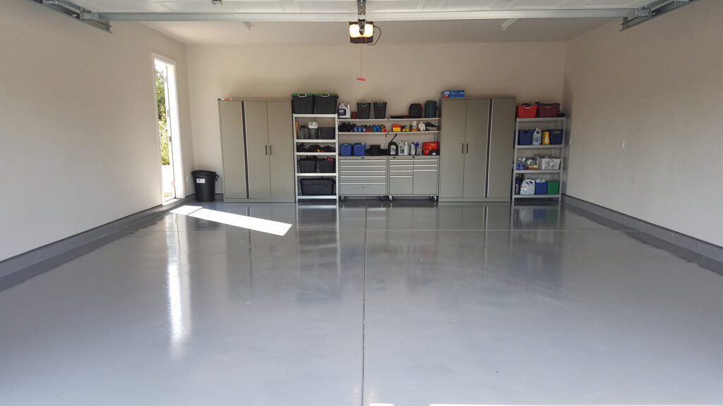 Containers of used transmission and hydraulic fluid awaiting proper disposal